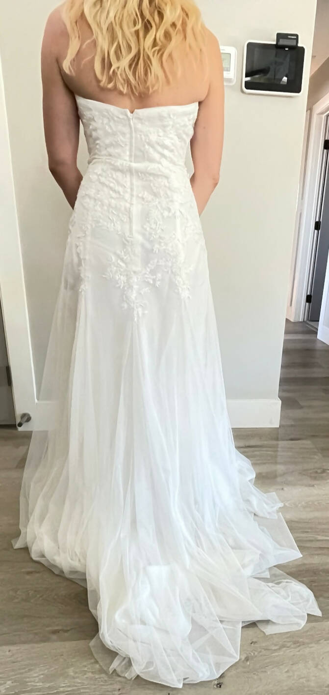 Embroidered A-line bridal gown with train